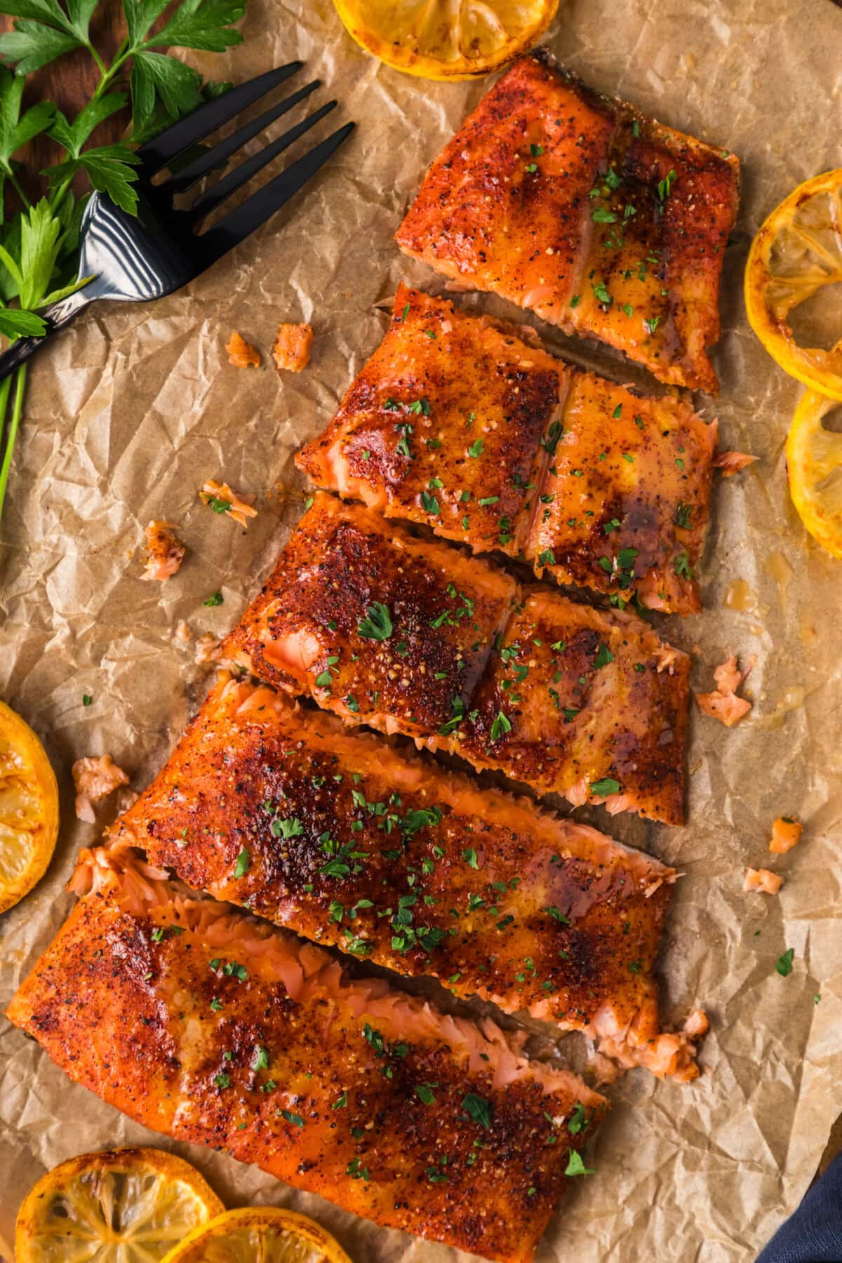 Smoked Salmon cut into filets resting on parchment paper