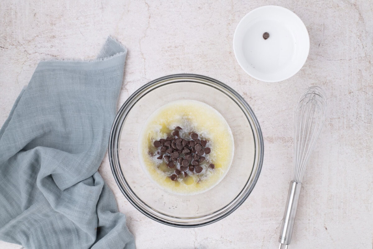 chocolate chips in a bowl with melted butter