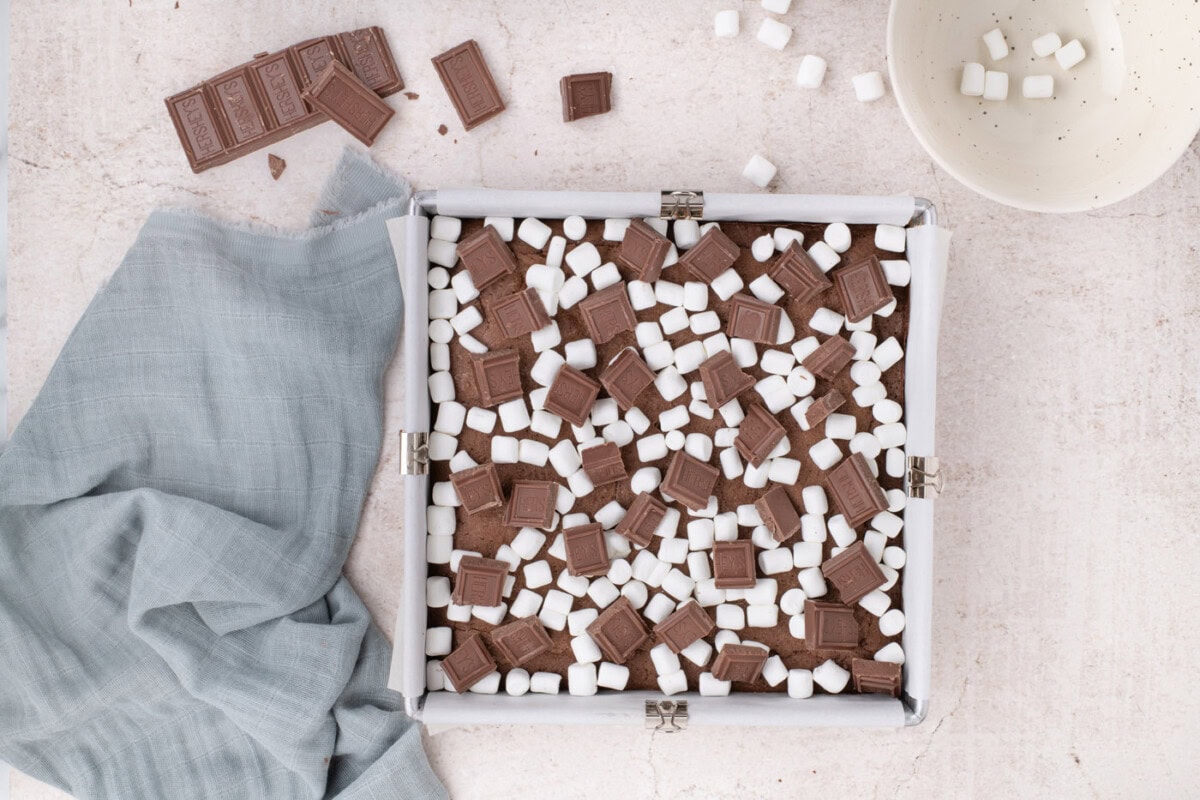 s'mores brownies topped with Hershey's chocolate and mini marshmallows