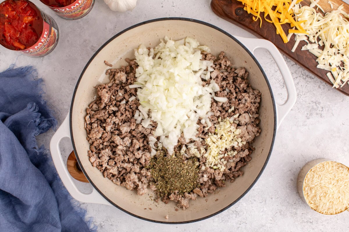 onion, Italian seasoning, and garlic added to Italian sausage and ground beef