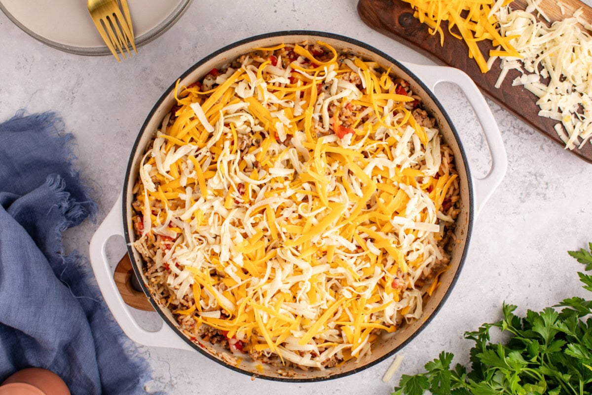 shredded cheese on top of stuffed pepper casserole