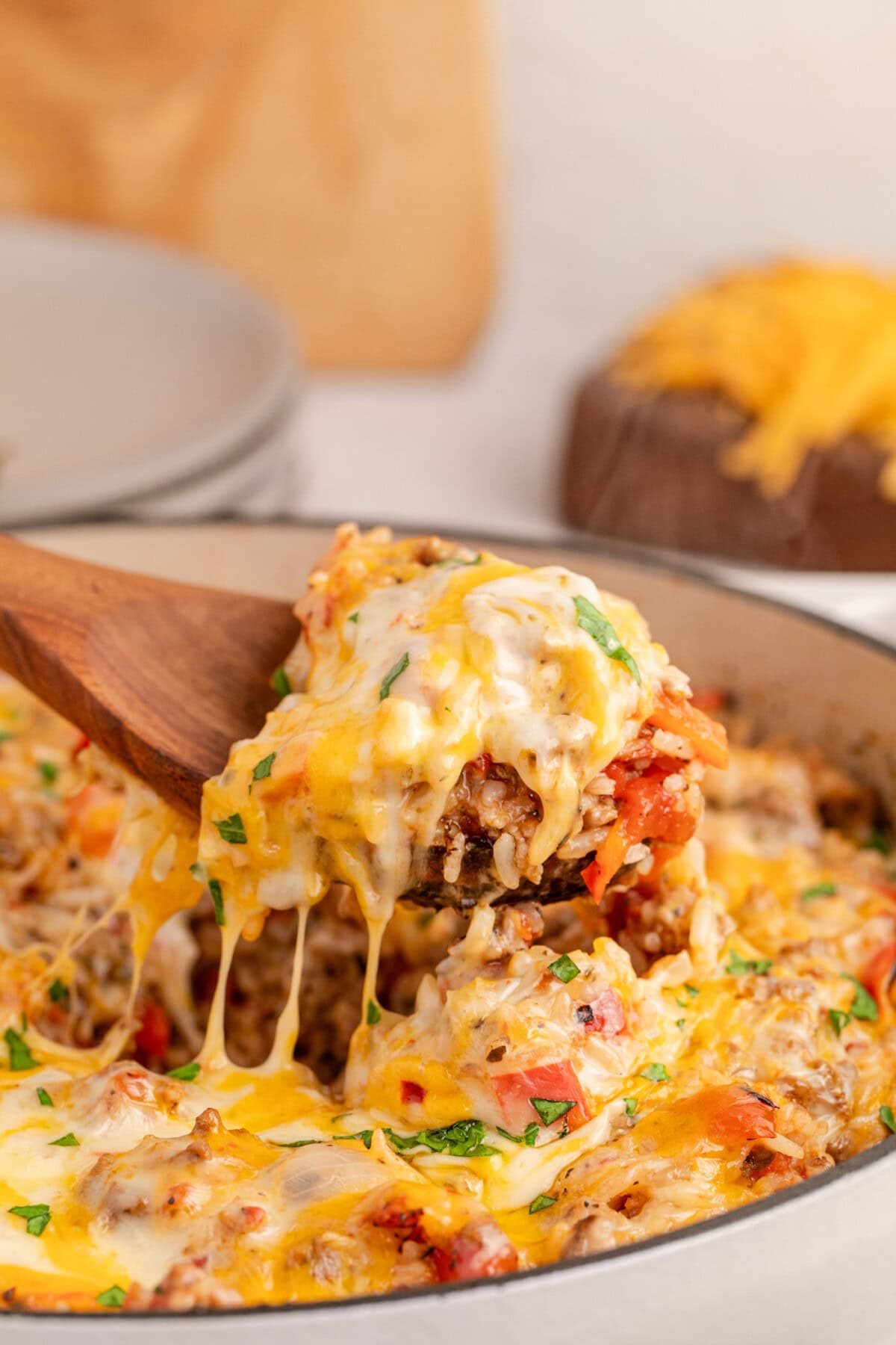 Spoonful of Stuffed Pepper Casserole being lifted out of the casserole dish
