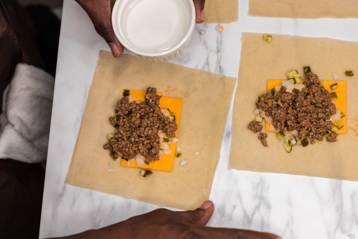 using water to wet the sides of an egg roll wrapper