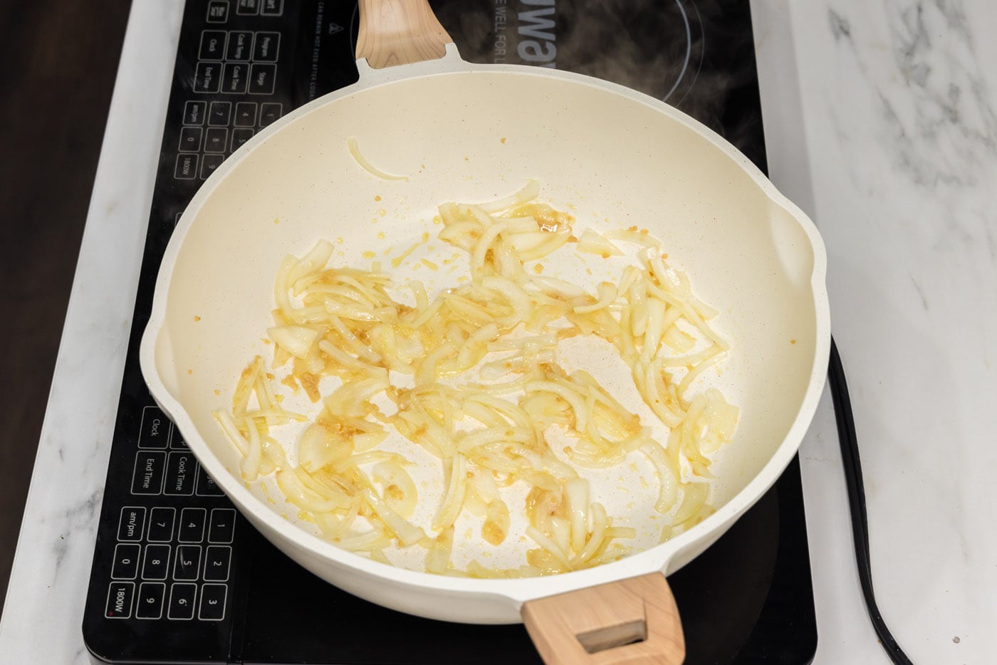 garlic and onion in a pan with oil