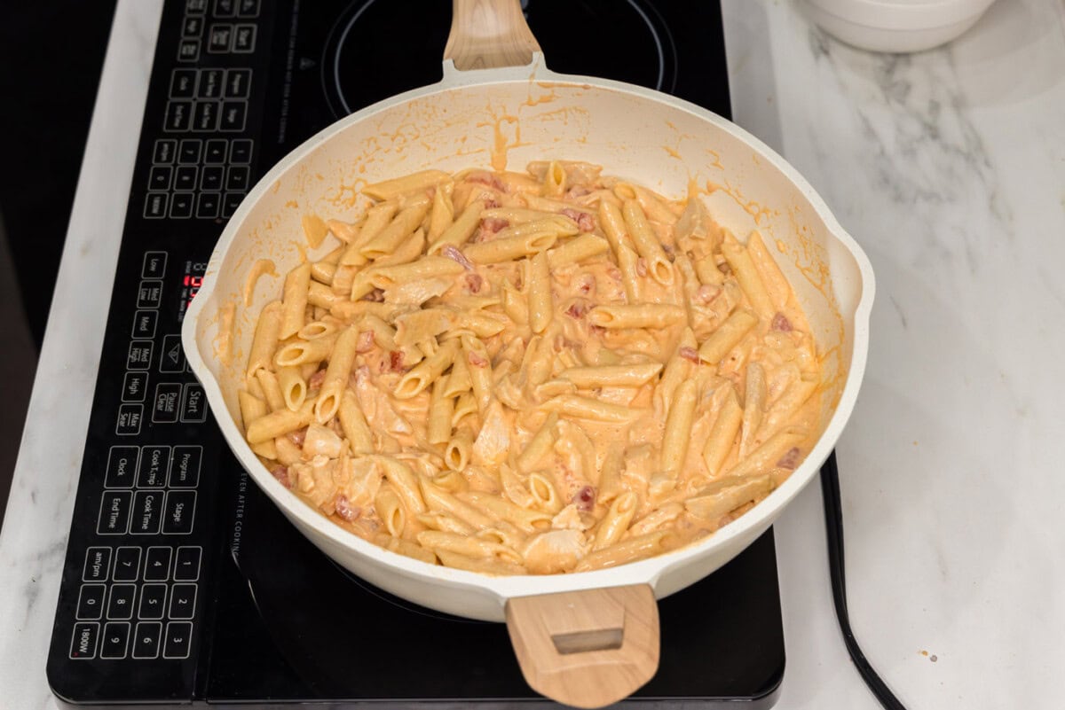 creamy buffalo chicken pasta in a skillet