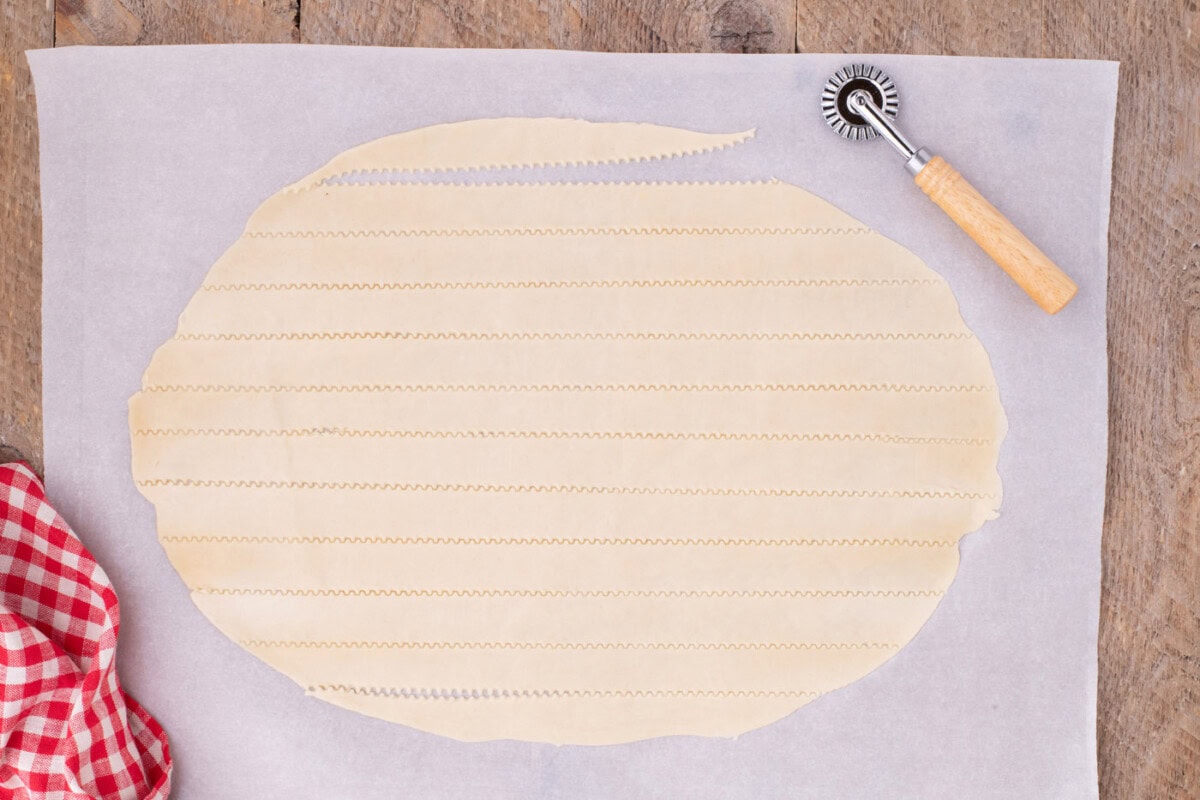 slicing strips of pie crust