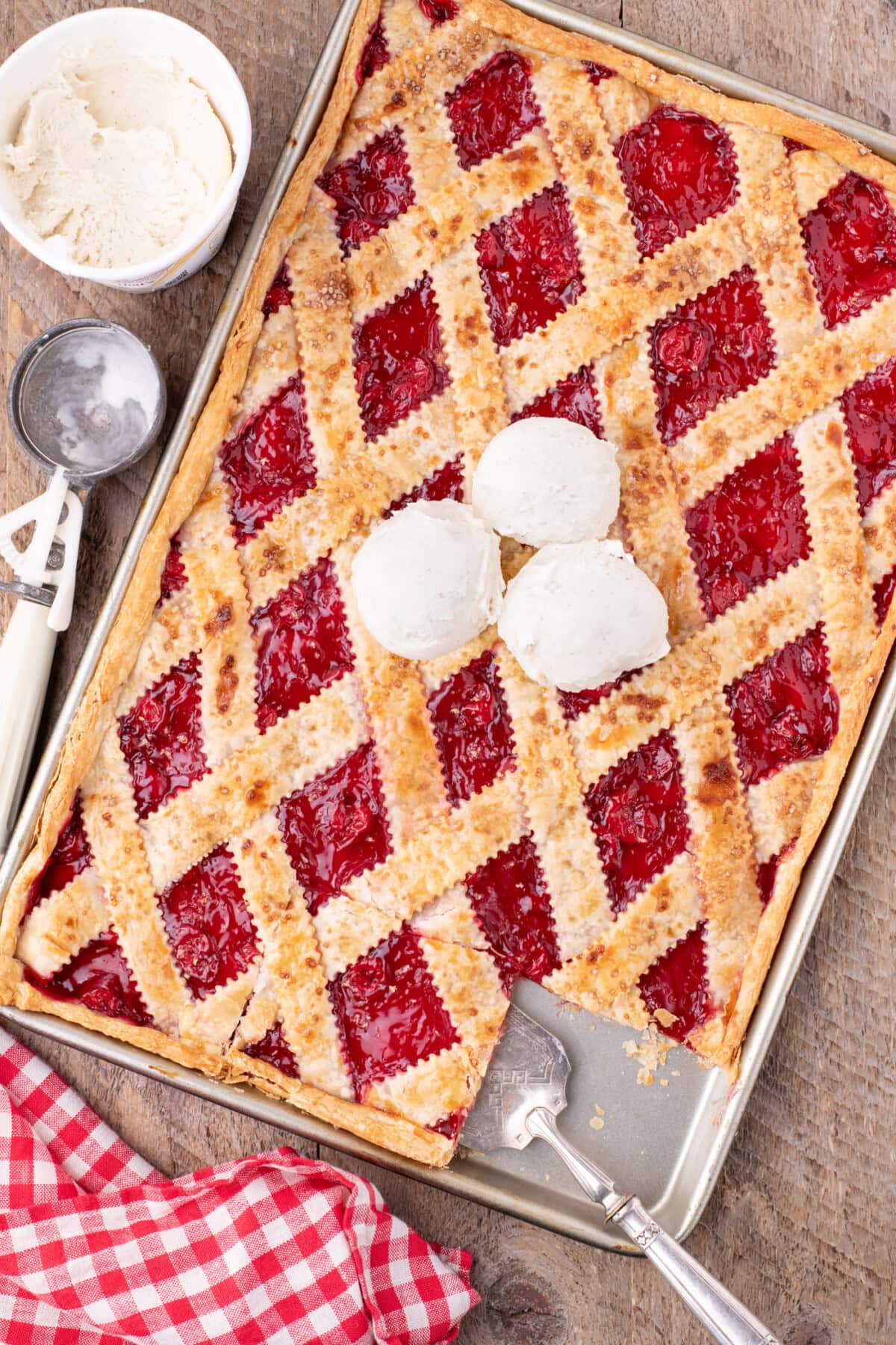 Cherry Slab Pie topped with three scoops of ice cream