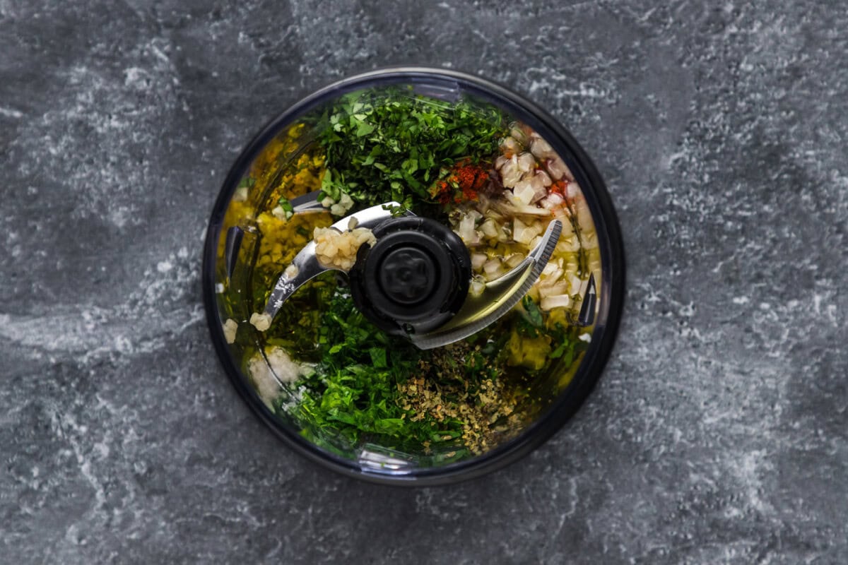 chimichurri ingredients in a mini food processor