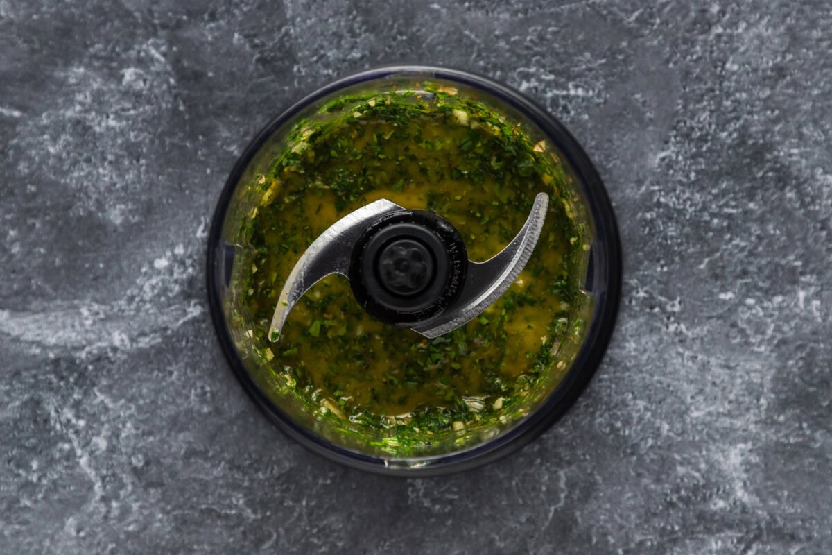 blitzed chimichurri ingredients in a mini food chopper