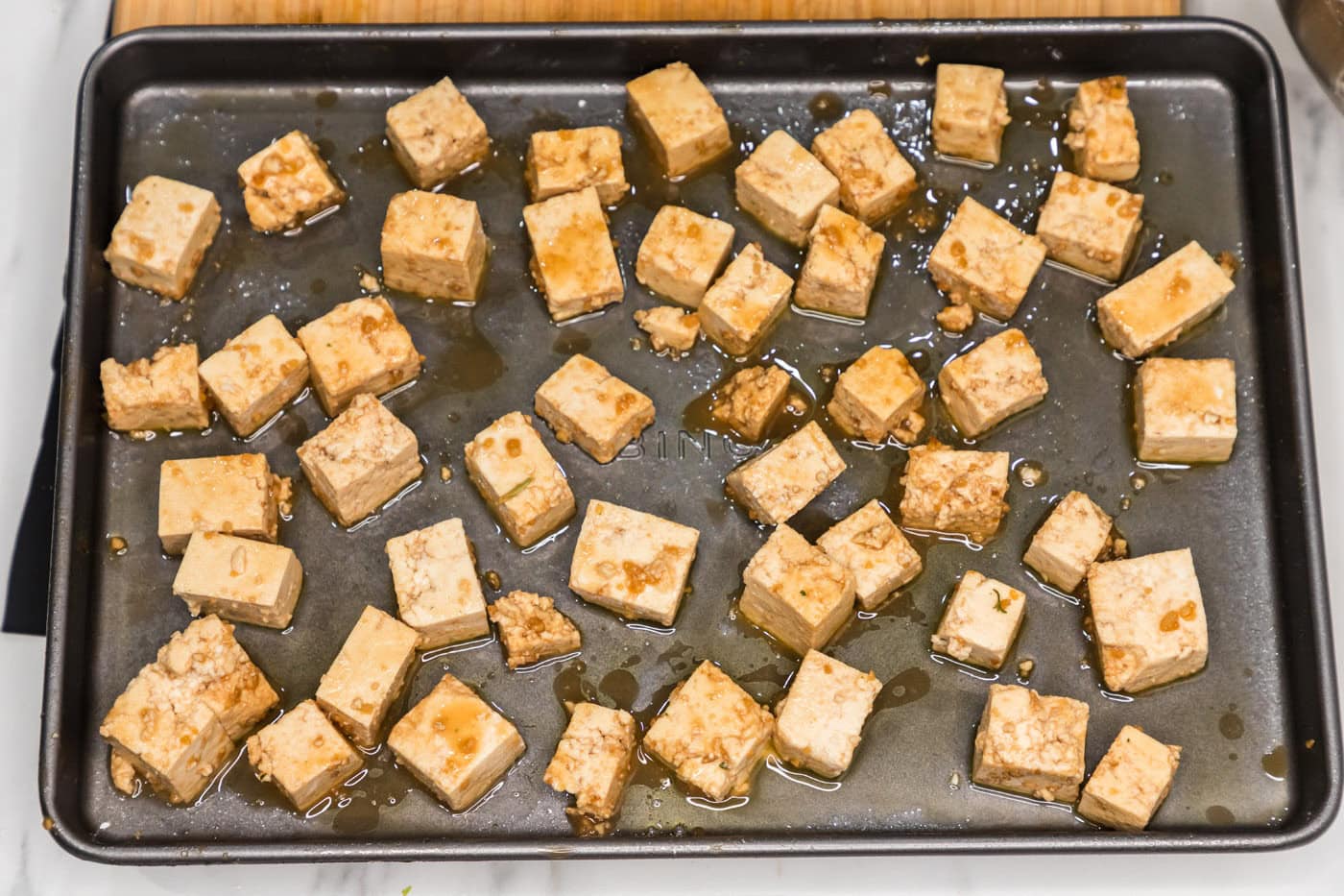 sheet pan of honey garlic tofu
