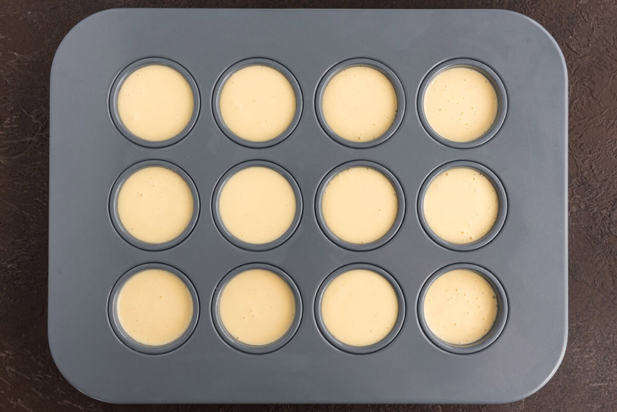 cheesecake batter filled inside mini cheesecake pan