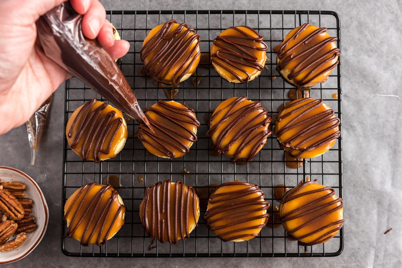 drizzled chocolate over caramel cheesecakes