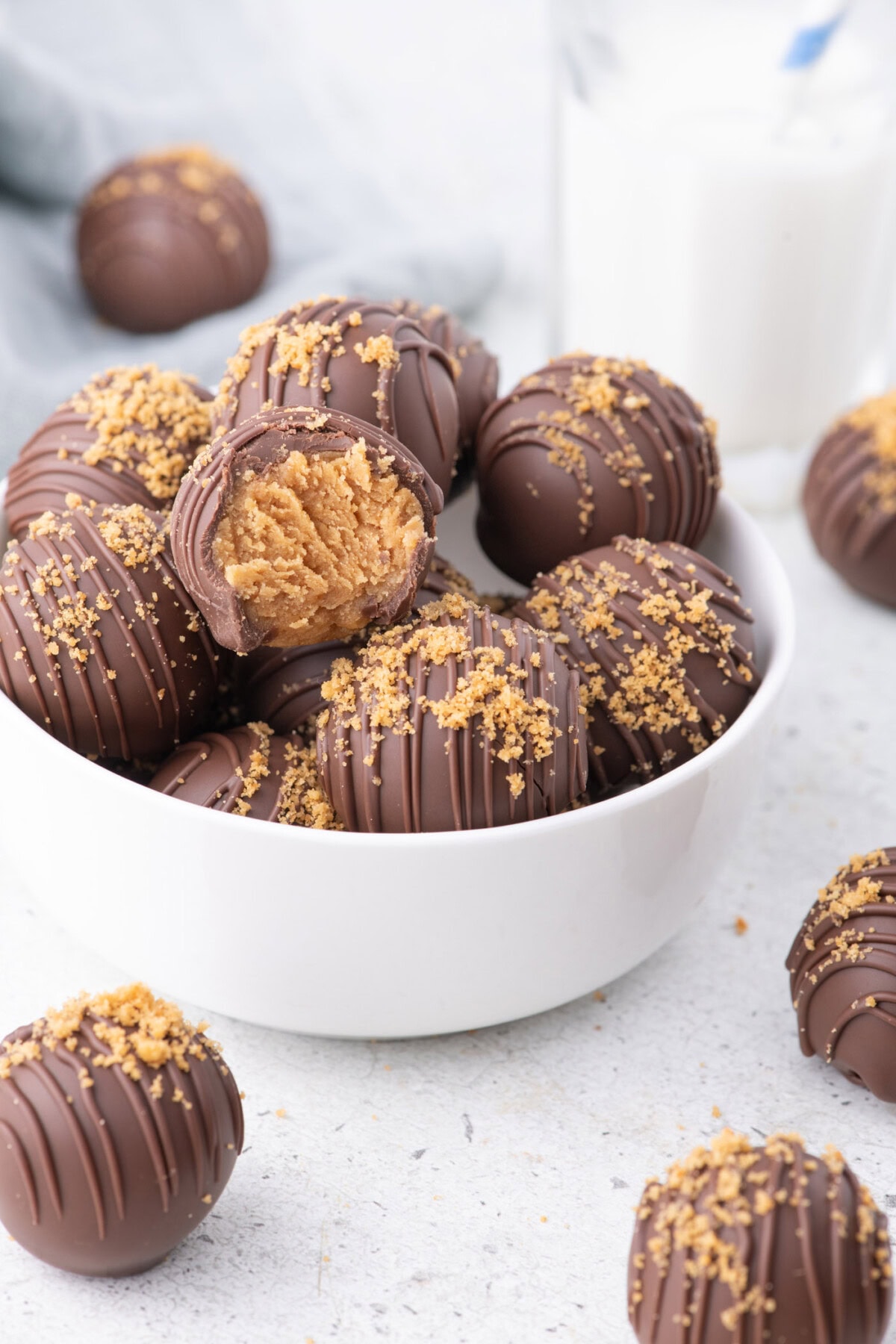 Bowl of Nutter Butter Balls with more resting on the table