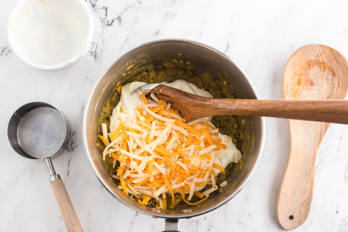 sour cream and shredded cheese added to pan with green chiles