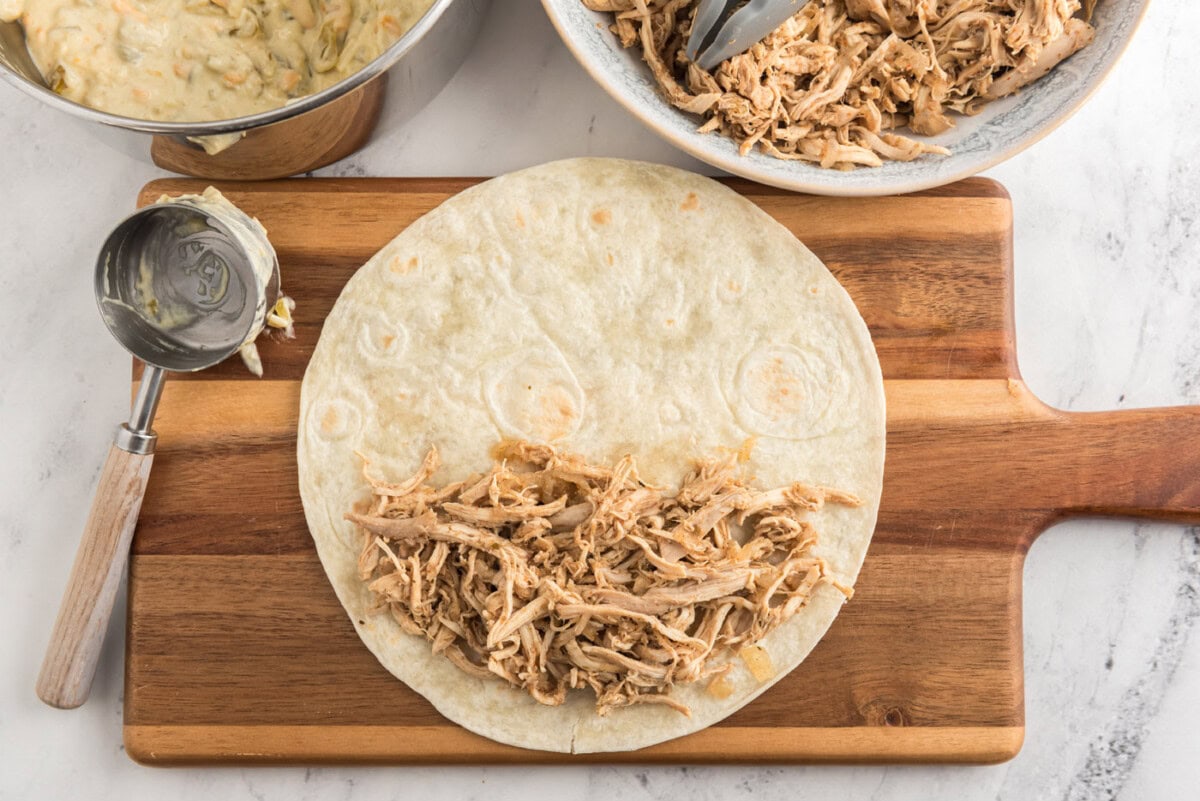 shredded chicken on a flour tortilla
