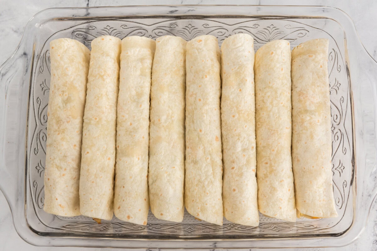 rolled enchiladas in a baking dish