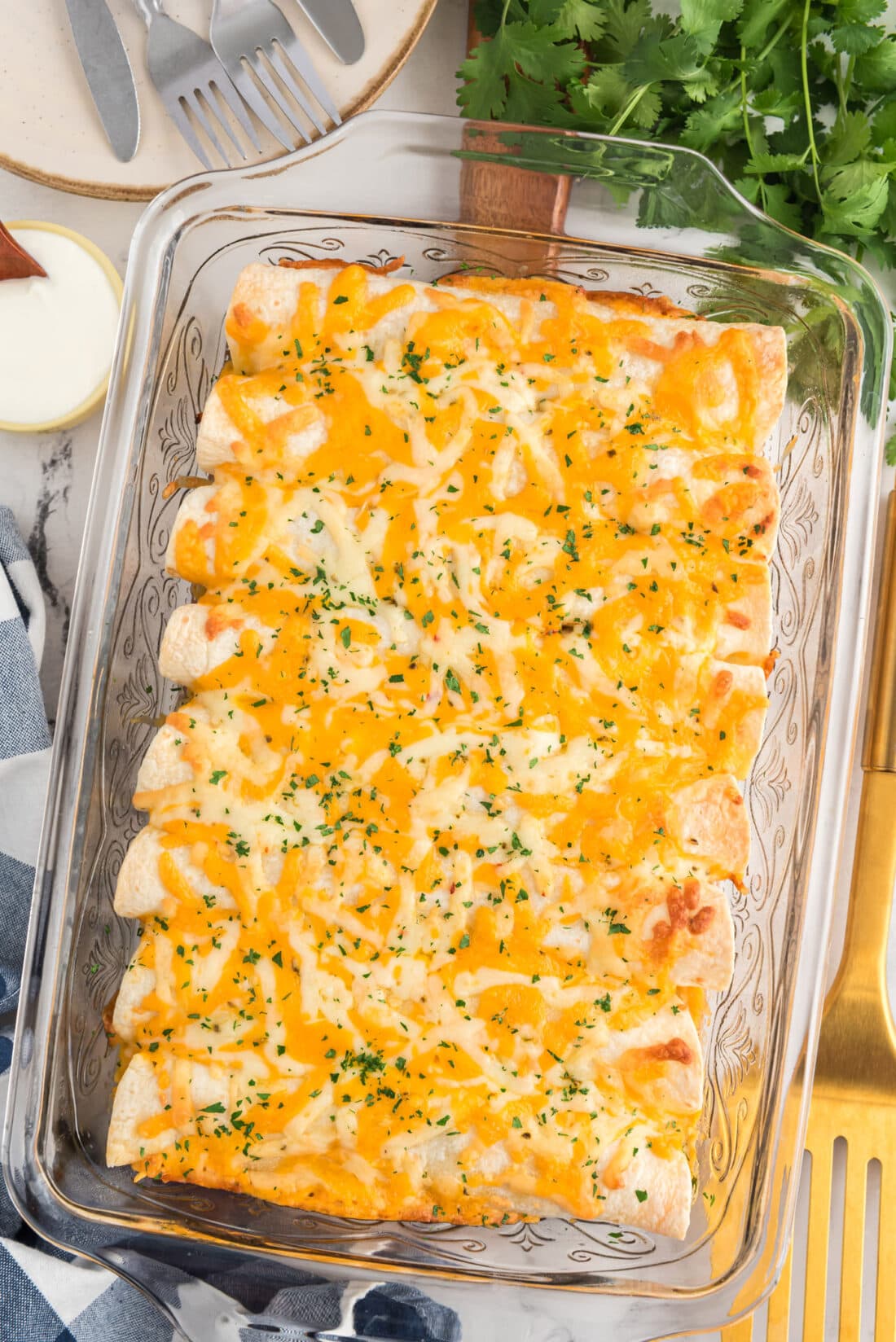 Shredded Chicken and Chile Enchiladas in a glass baking dish