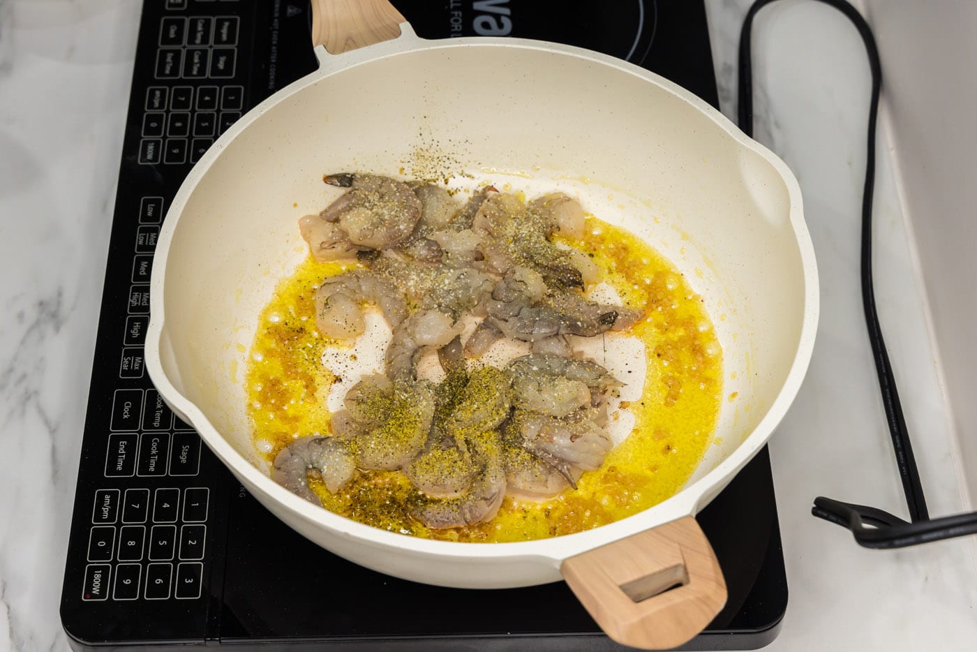 shrimp in a skillet with olive oil and garlic
