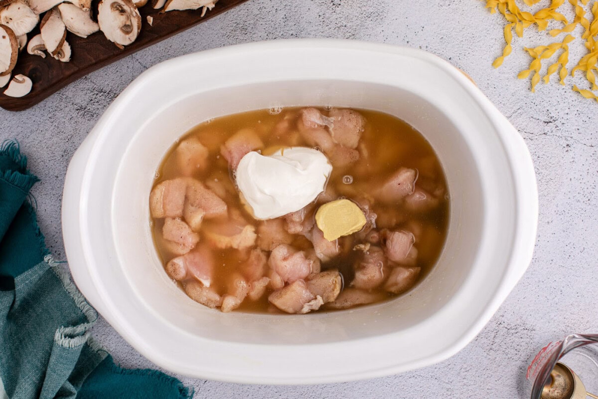 sour cream, chicken stock,dijon, and Worcestershire sauce in a crockpot with chicken