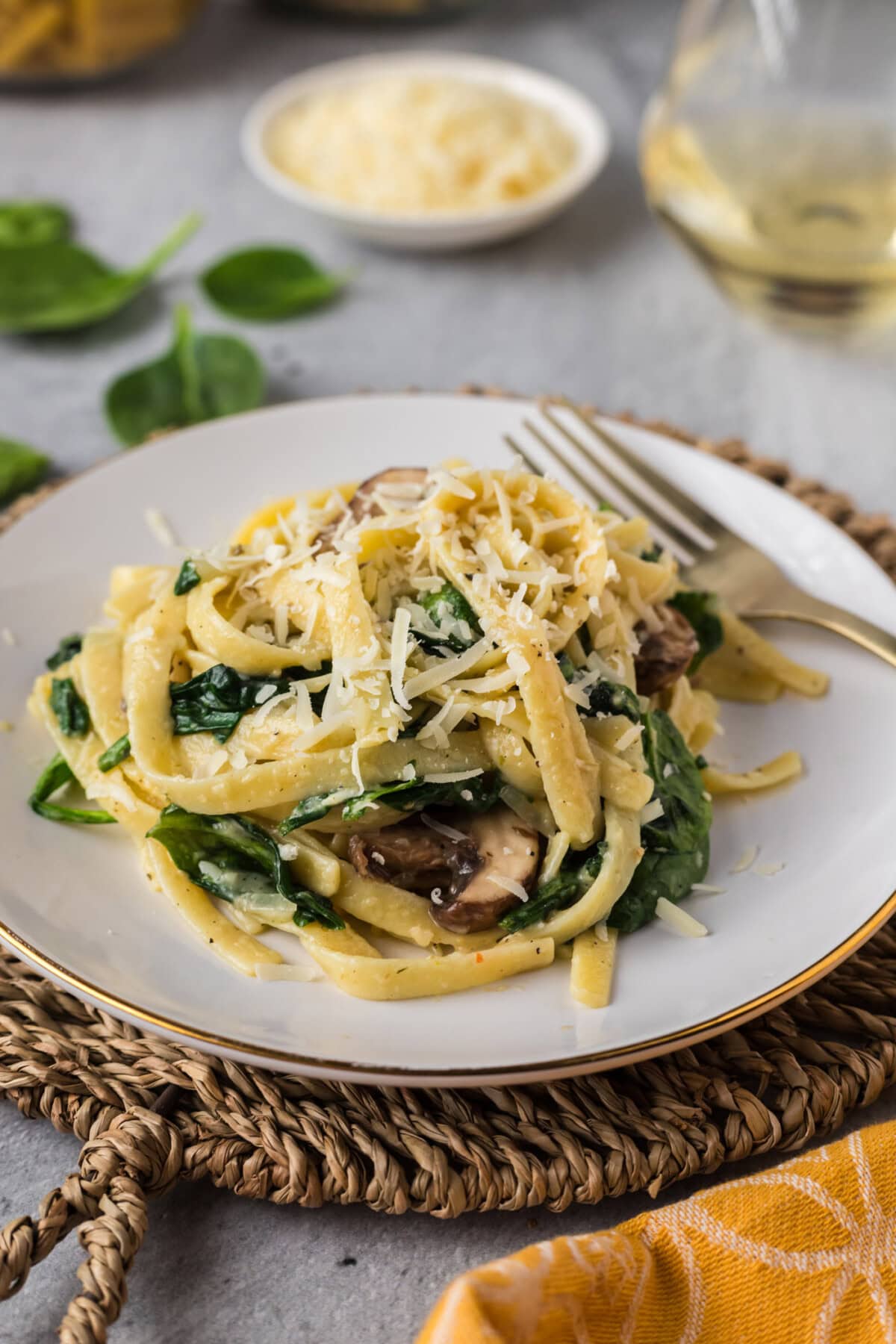 Spinach Fettuccine on a plate with a fork