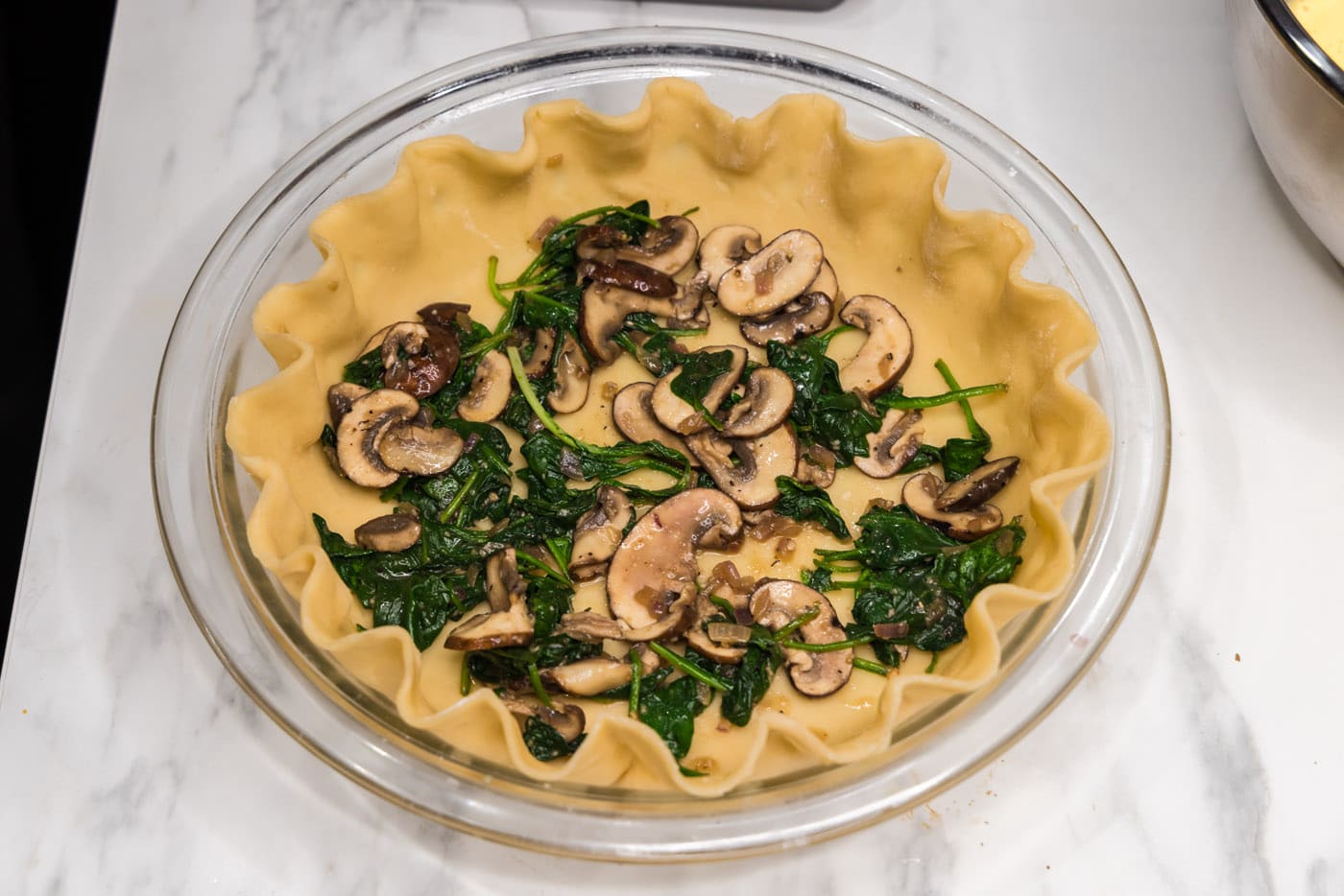 sauteed mushroom and spinach in a pie crust