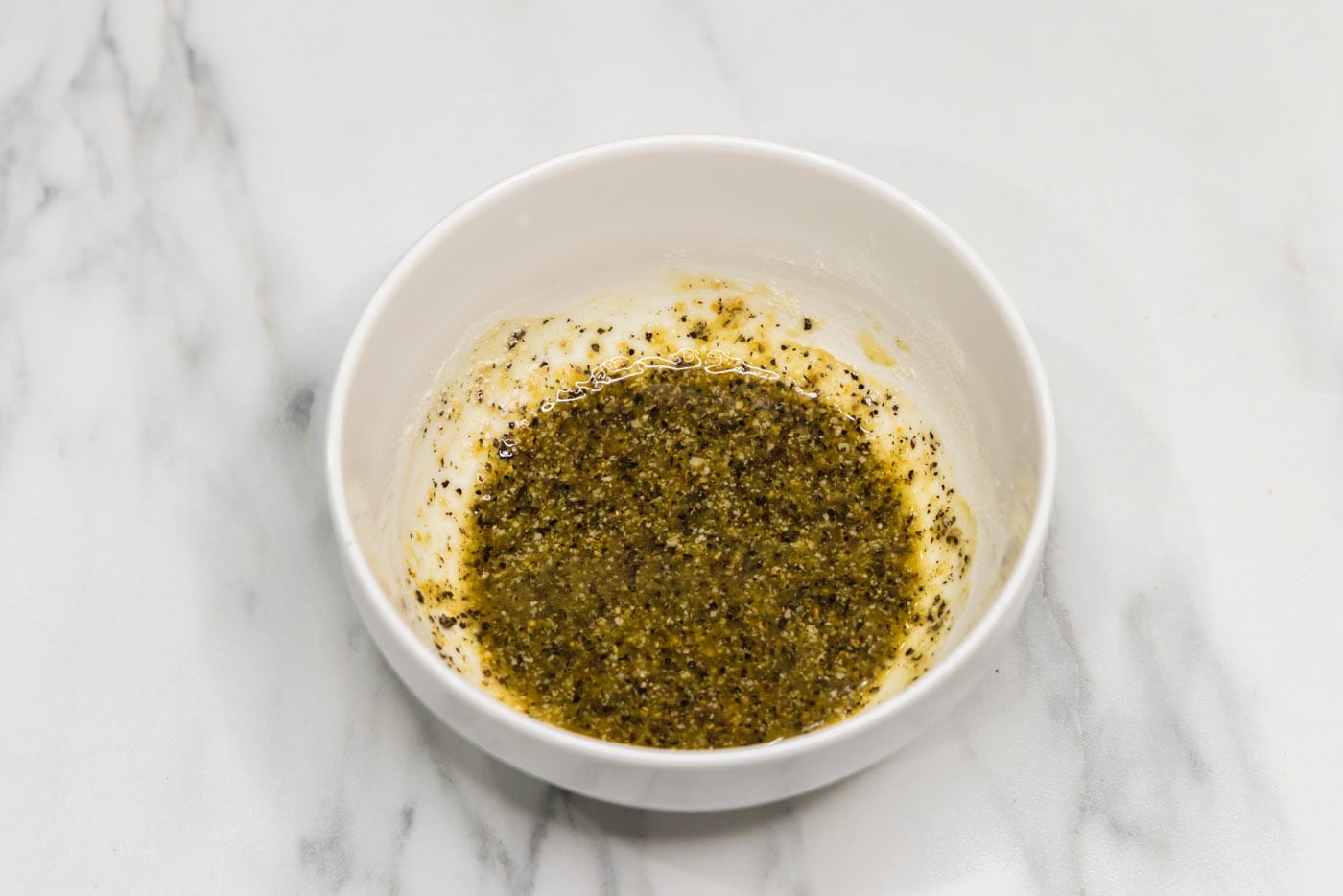 seasonings mixed with olive oil in a small bowl