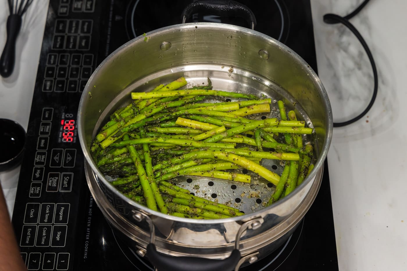 steamed asparagus in a pot