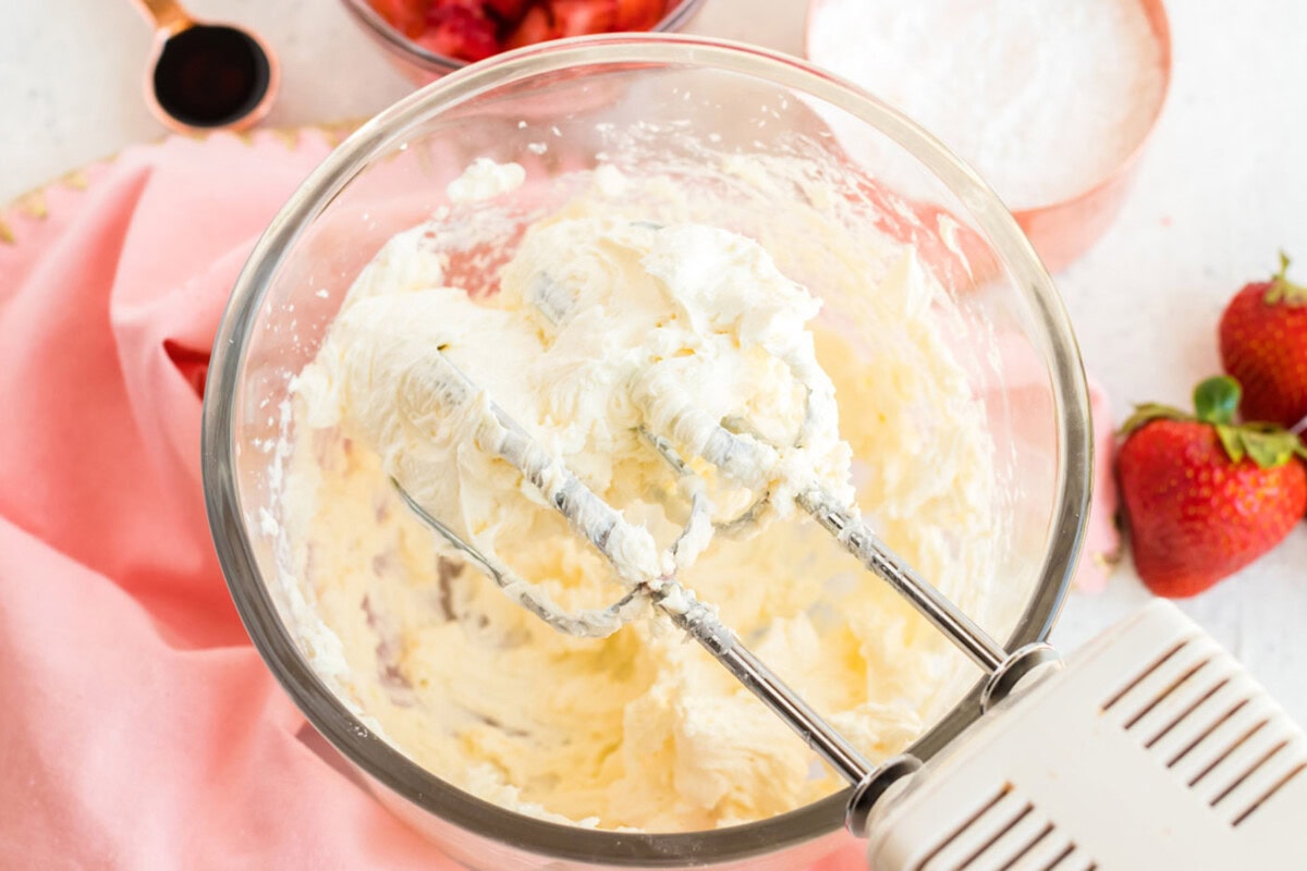 Cream cheese and powdered sugar beaten in a bowl