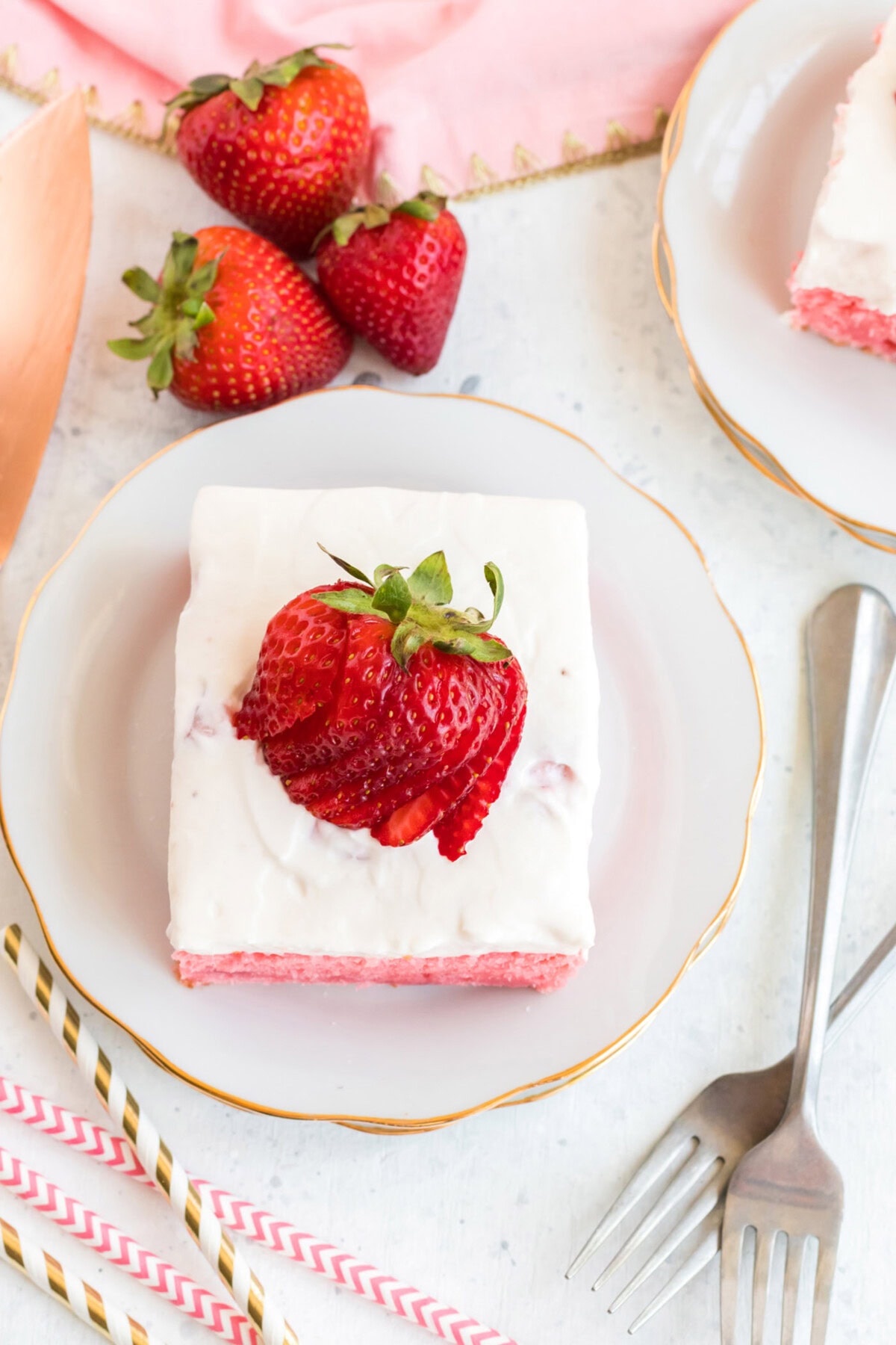 Overhead photo of a slice of Strawberry Cake on a plate