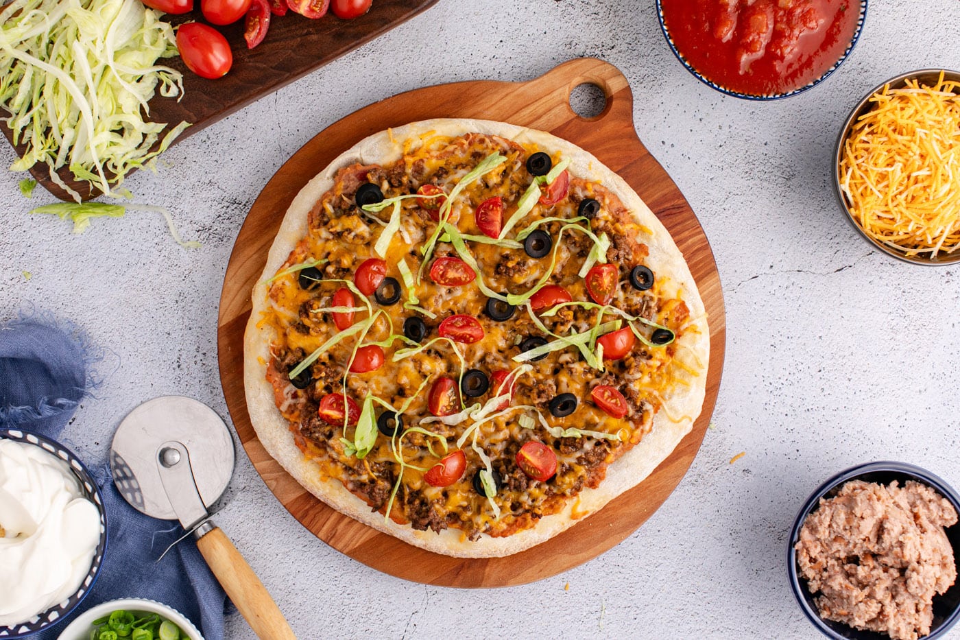 easy baked taco pizza on a serving board