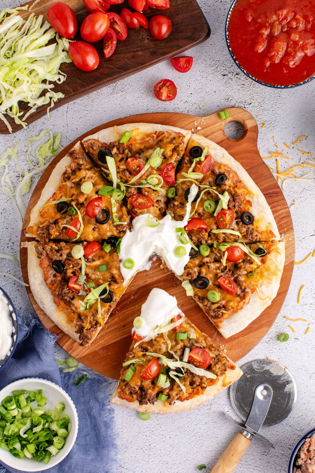 Overhead photo of a Taco Pizza cut into slices