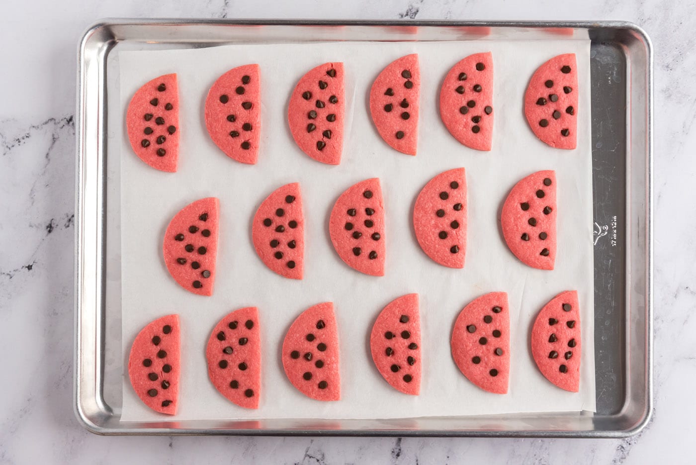 watermelon cookies on a baking sheet