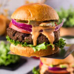 Black Bean Burger lifted up on a spatula