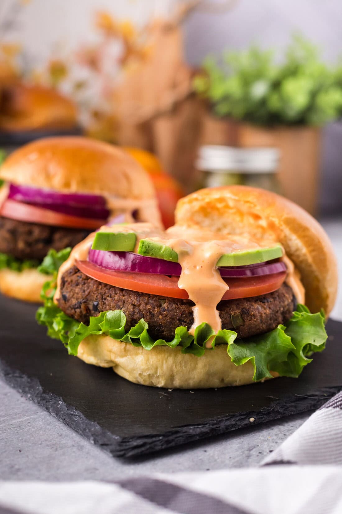 Close up photo of a Black Bean Burger with the top bun removed