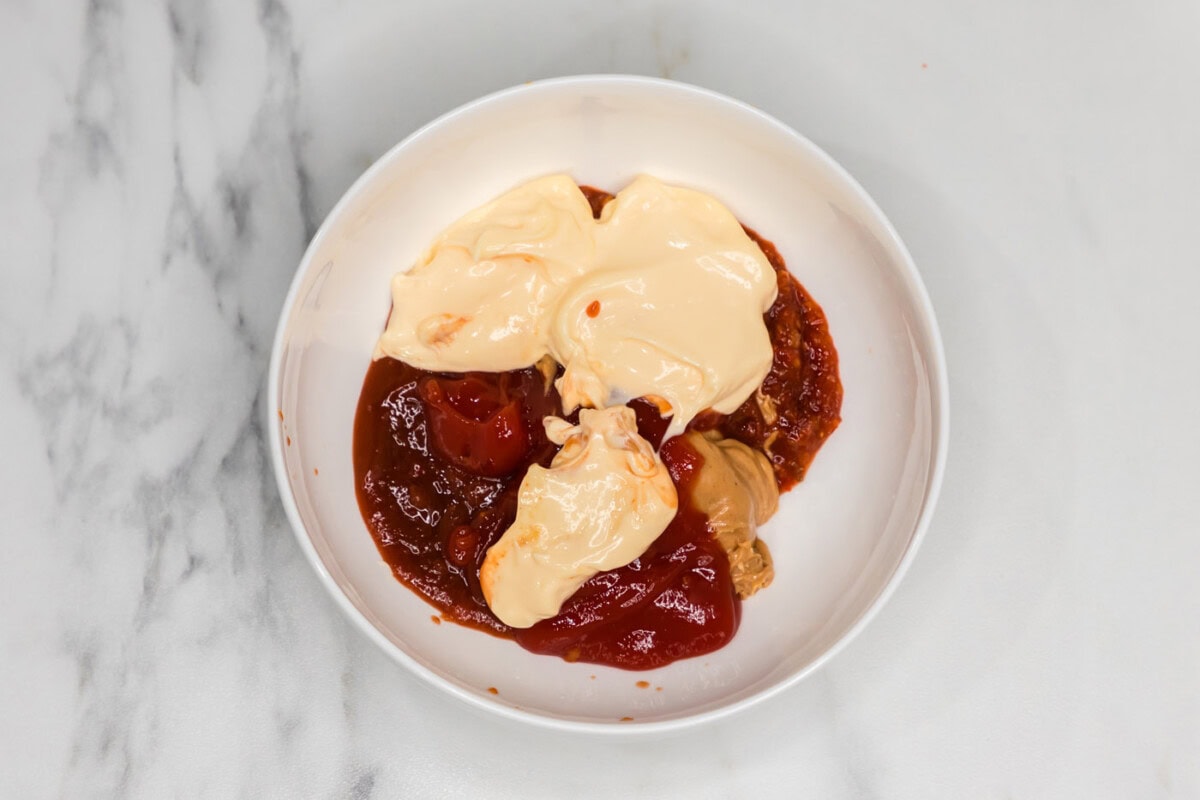 peanut butter, Asian sweet chili sauce, sriracha, ketchup, and mayonnaise in a bowl
