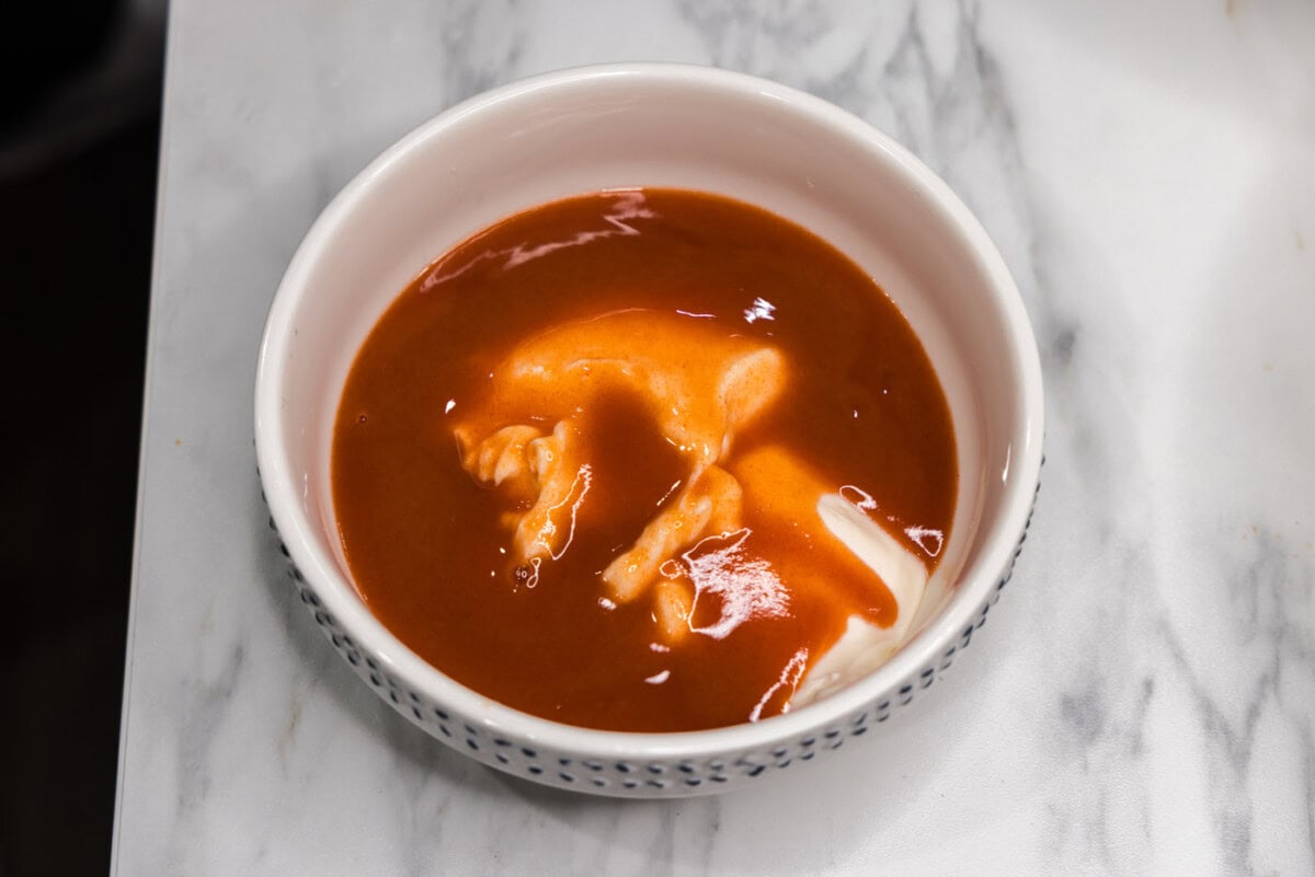 hot sauce and mayonnaise in a small bowl