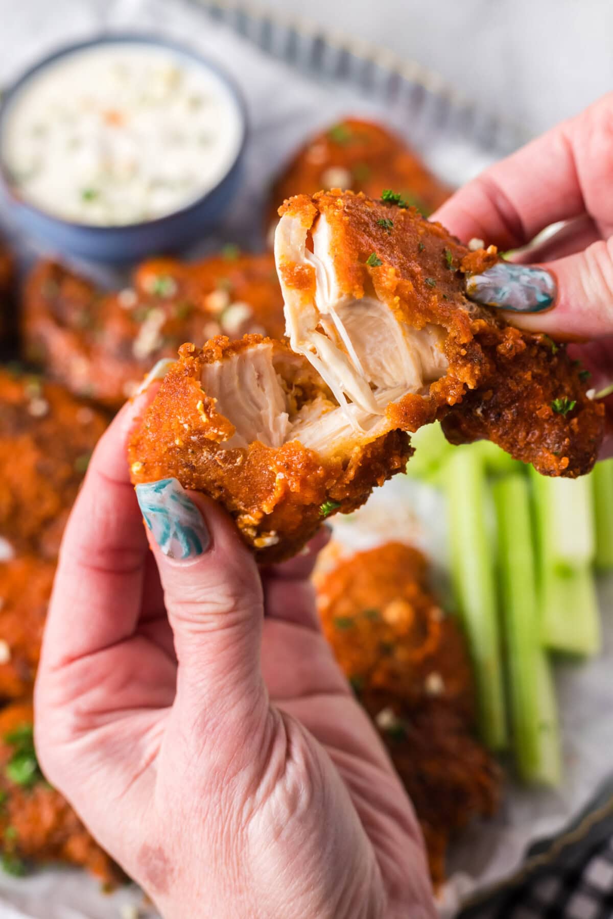 Buffalo Chicken Tender broken in half
