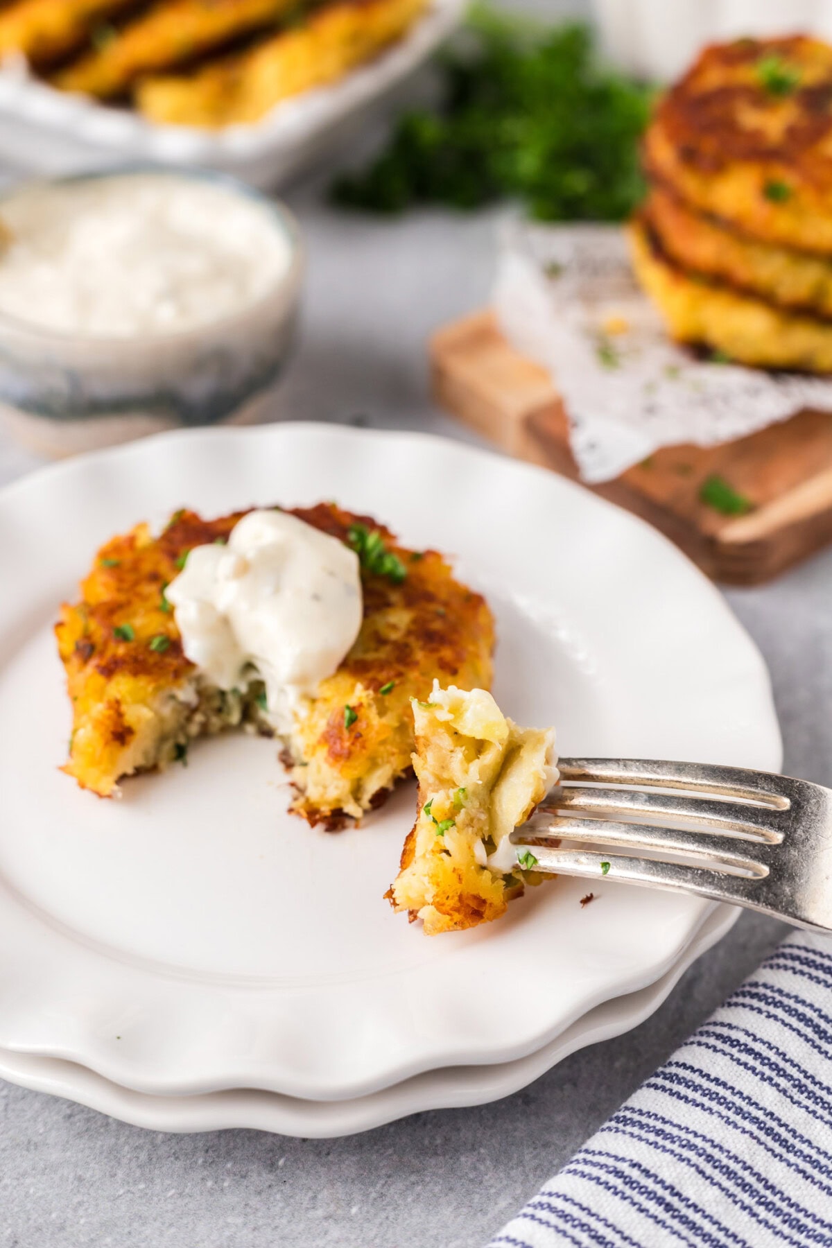 Cod Fish Cake on a plate with a piece on a fork