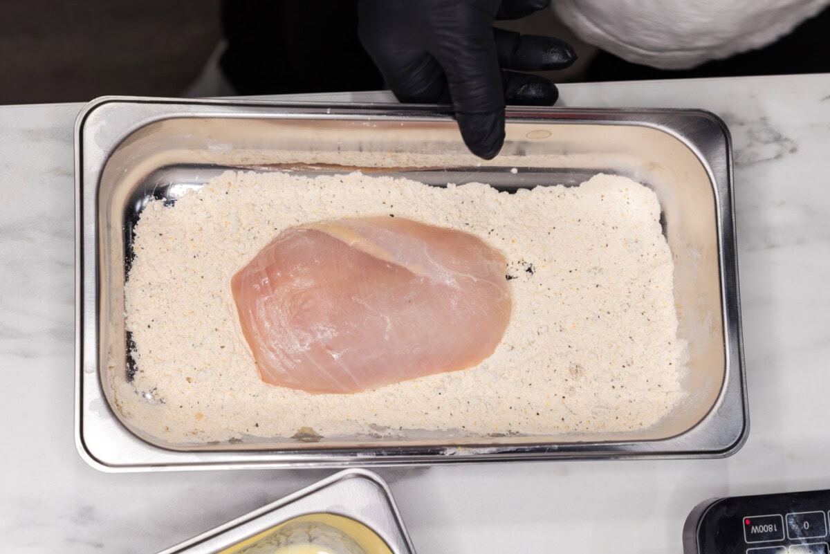 chicken breast dipped in flour and seasonings