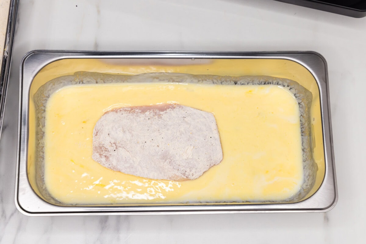 breaded chicken breast in buttermilk mixture