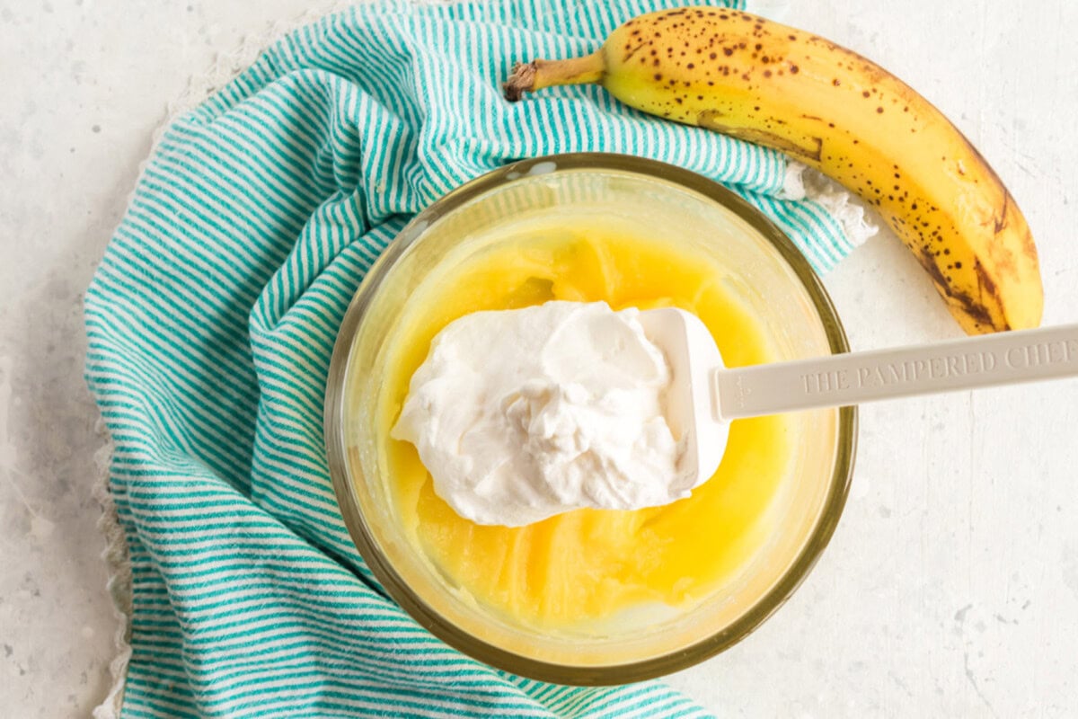 whipped topping added to pudding in bowl