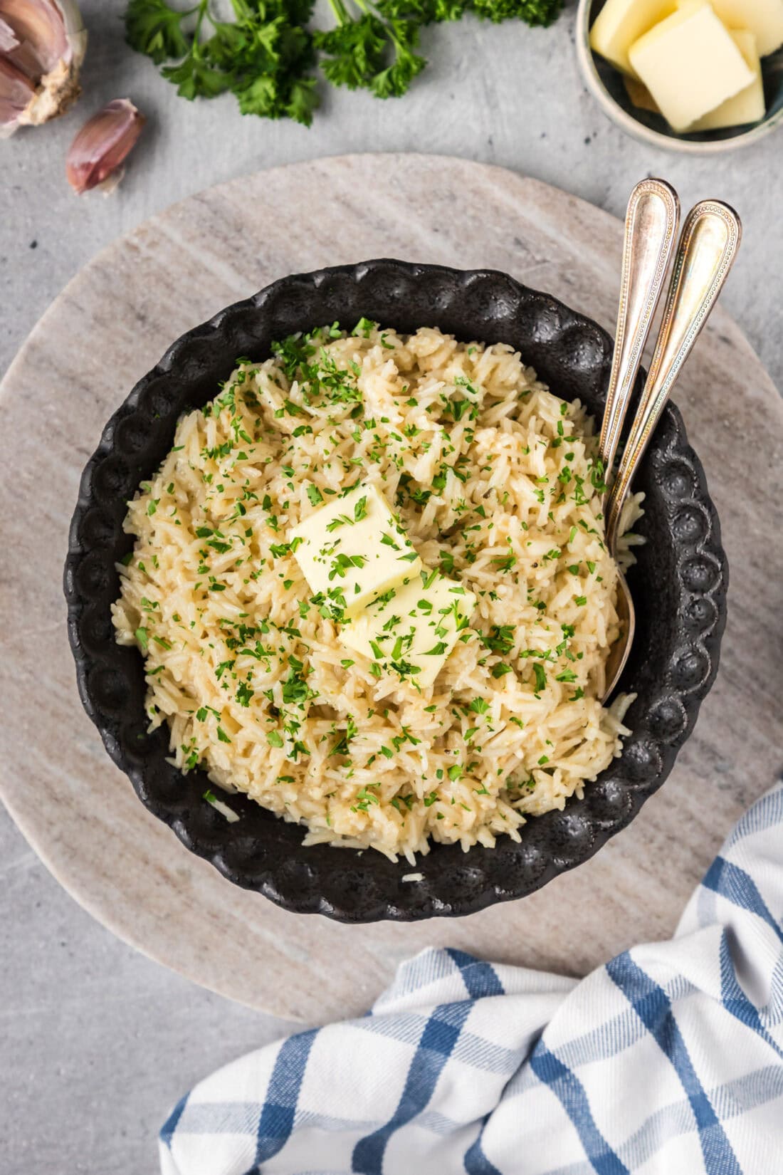 Bowl of Garlic Butter Rice with two spoons in it