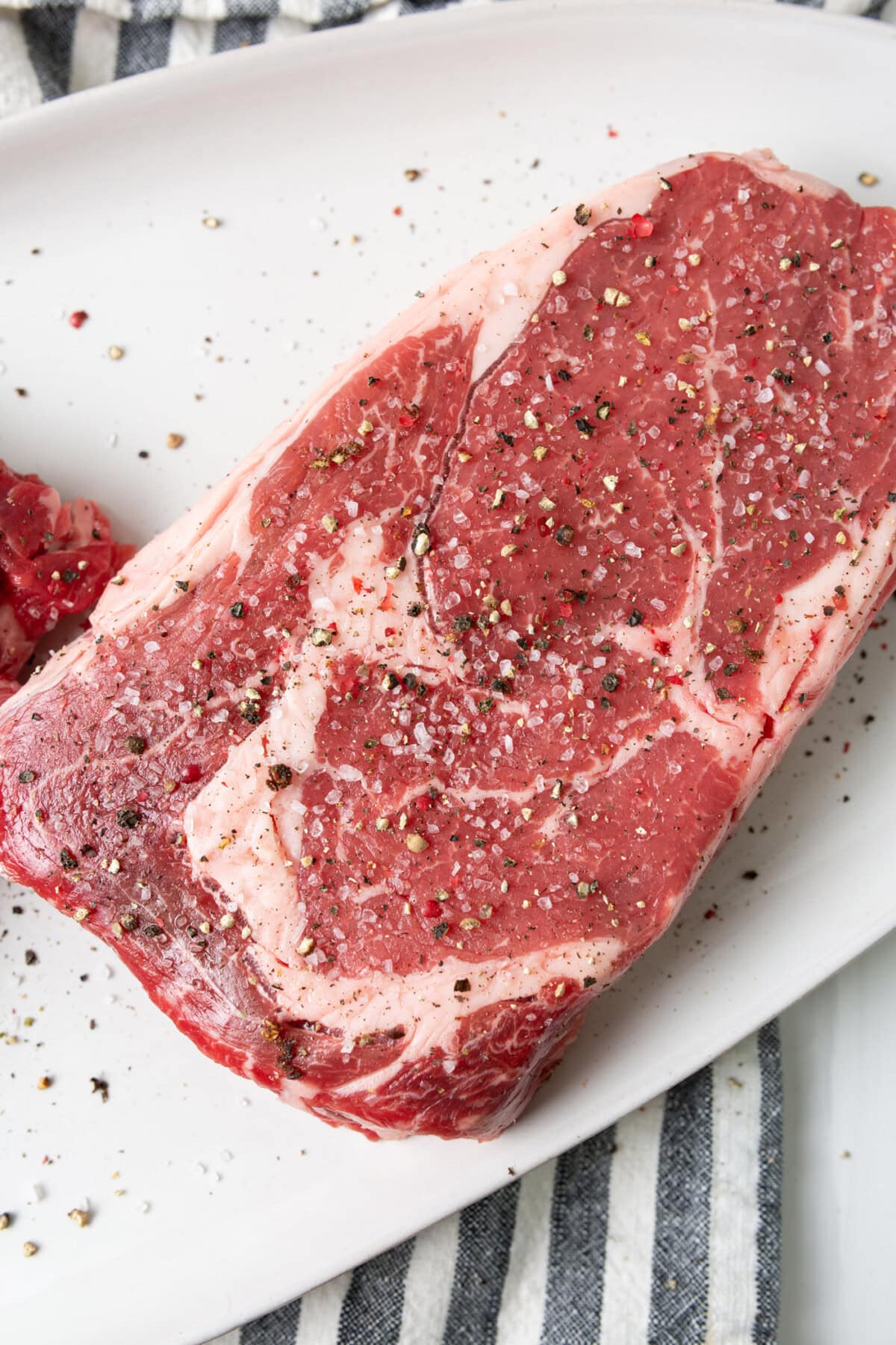 Steak seasoned with salt and pepper