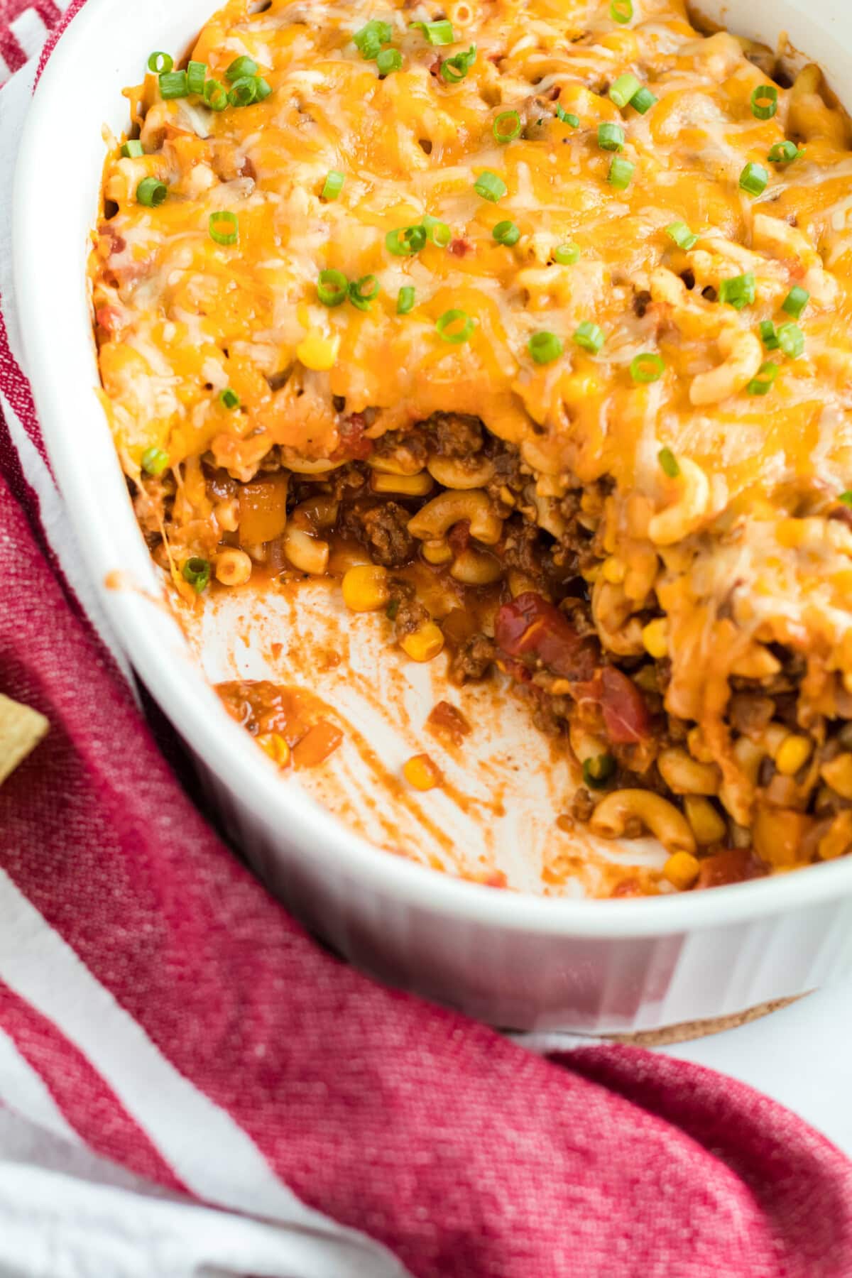 casserole dish with a scoop of southwest ground beef casserole removed