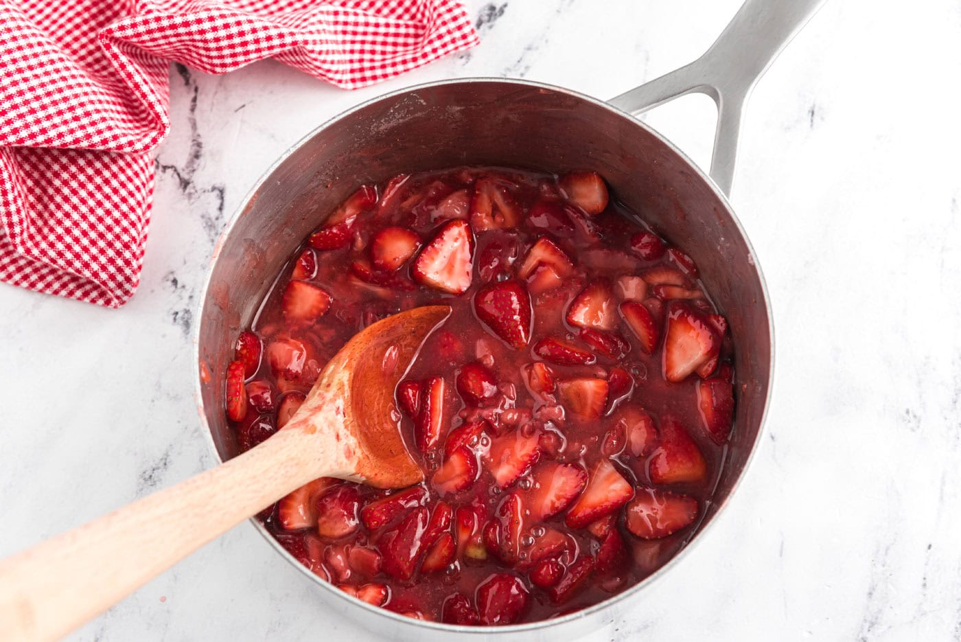 homemade macerated strawberry sauce in a saucepan