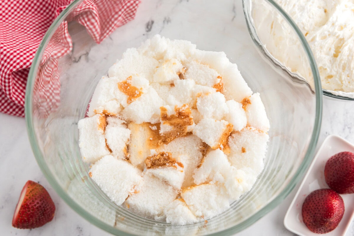cubed angel food cake in a trifle bowl