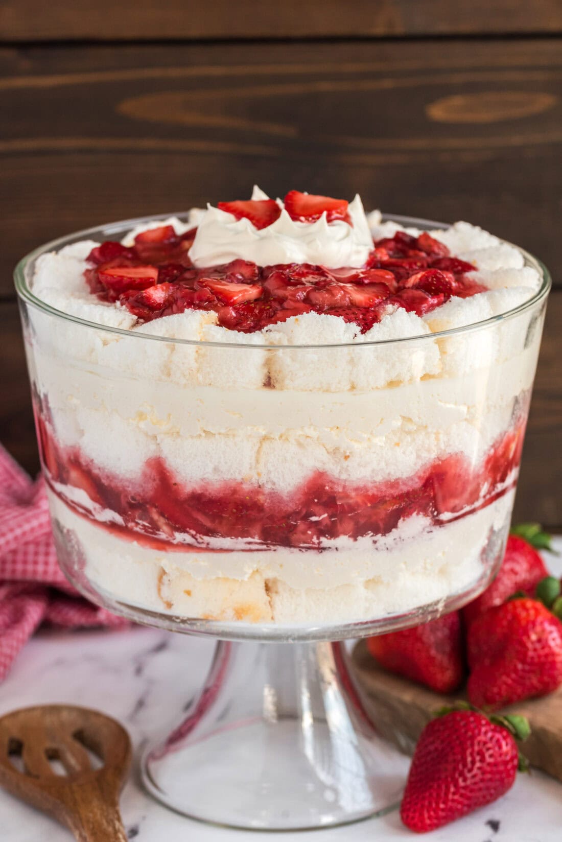 Strawberry Shortcake Trifle with strawberries in the background
