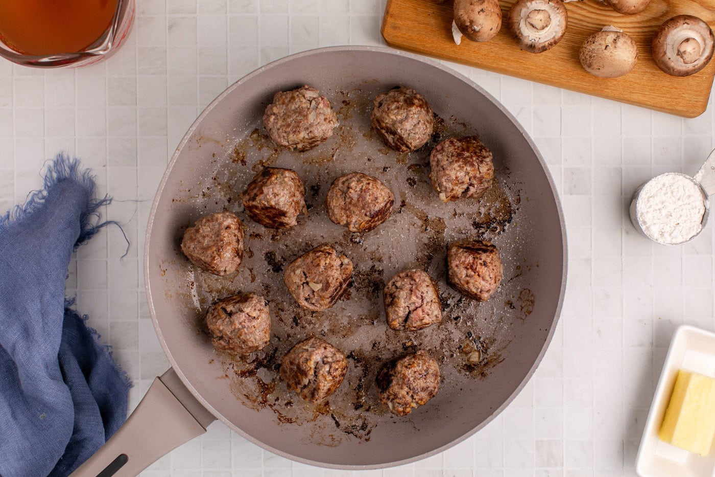 cooking meatballs in a skillet