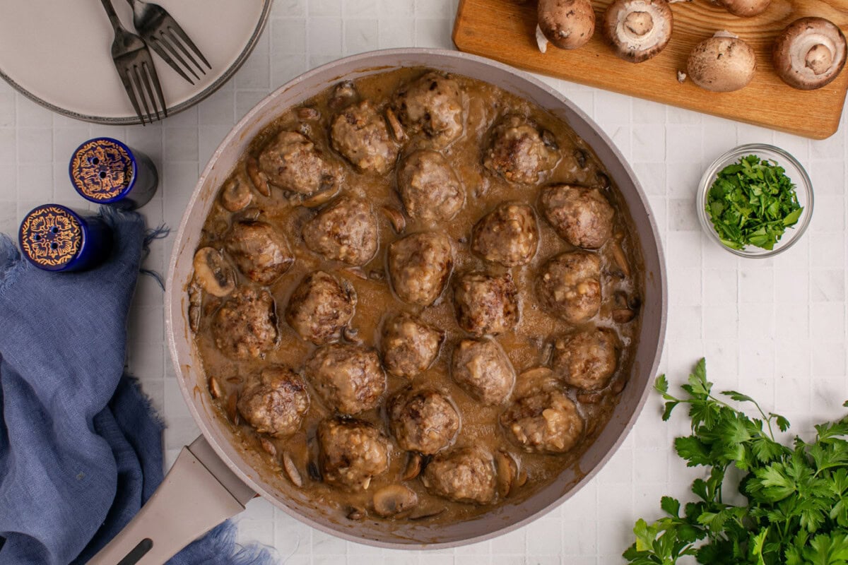 finished overhead of salisbury steak meatballs in a skillet