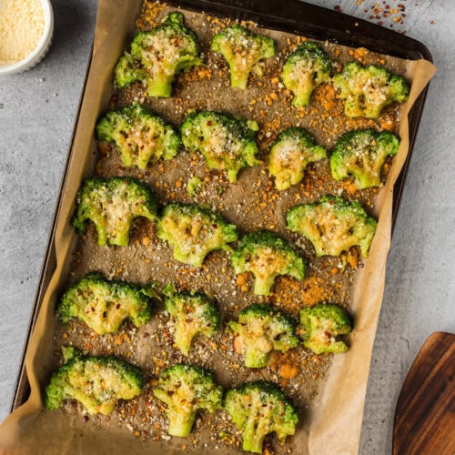 Smashed Broccoli on a parchment lined baking sheet